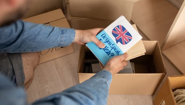 Indian student arriving in London with an NDLS Cargo box for shipping personal effects and luggage to the UK.